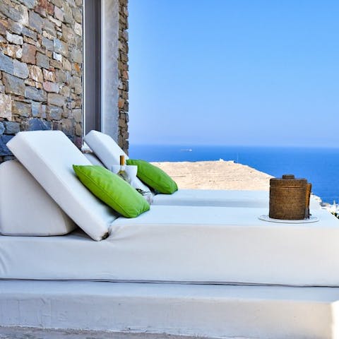 Lie on the day beds, soaking up the sun as you take in the sea views