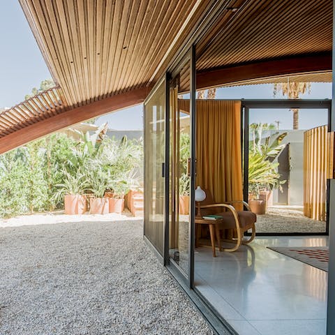 Floor-to-ceiling glass doors that bring the outside in