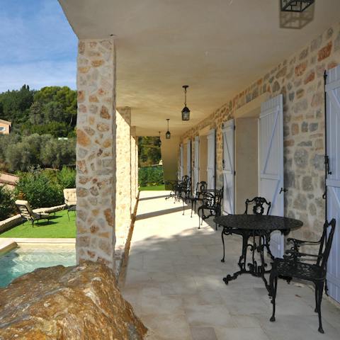 Have a glass of wine on the terrace, overlooking lush trees