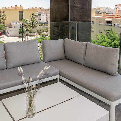 Sip a glass of wine or two on the outdoor sofa