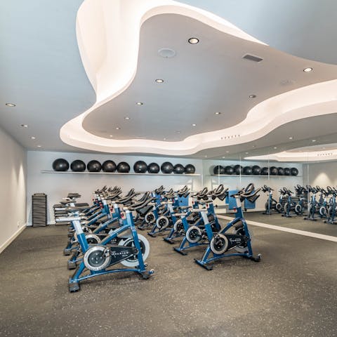Break a sweat during a spin class at the apartment's communal gym 