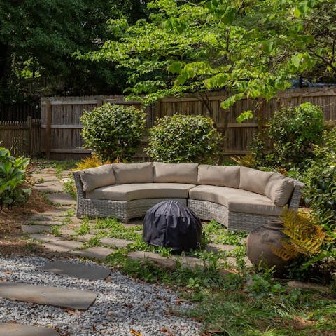 Spend balmy evenings gathered around the garden fire pit