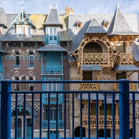 Take in the Art Nouveau buildings from your private balcony