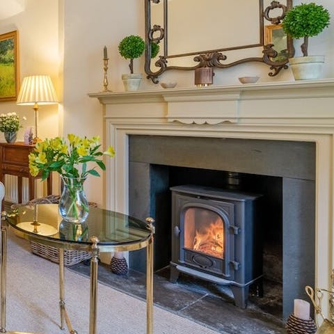 Cosy up in front of the fire place after a day out in the Cotswolds countryside 