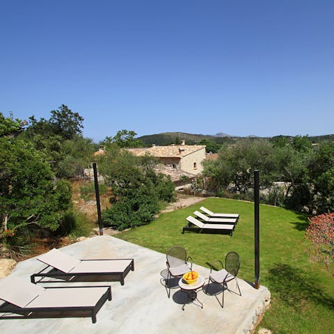 Take Balearic picnics out onto your lawn and dine alfresco atop this sunkissed patio