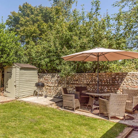 Cook up meats and veggies on the barbecue to enjoy around the dining set