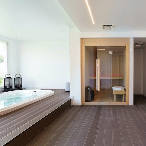 Make full use of the private hot tub and sauna in the wellness area
