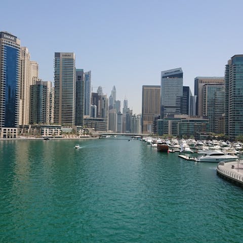 Explore Dubai Marina's shops and restaurants, a ten-minute taxi ride away