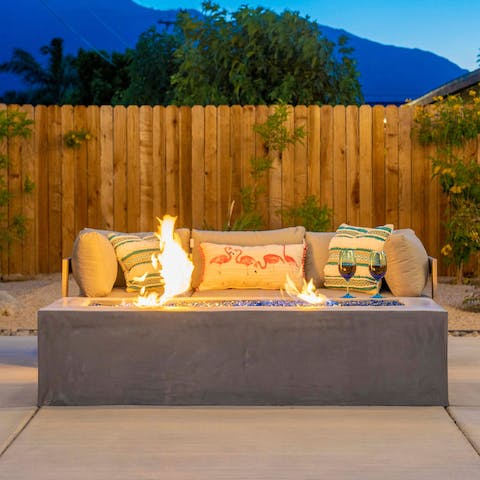 Share a bottle of Californian wine beside the fire pit on cool desert nights