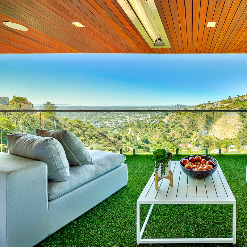 Lounge on the balcony while waiting for the sun to set over LA