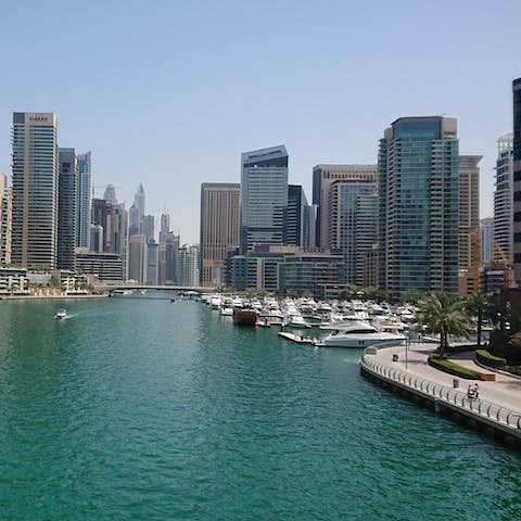Soak up the magic of Dubai Marina as you stroll along the promenade