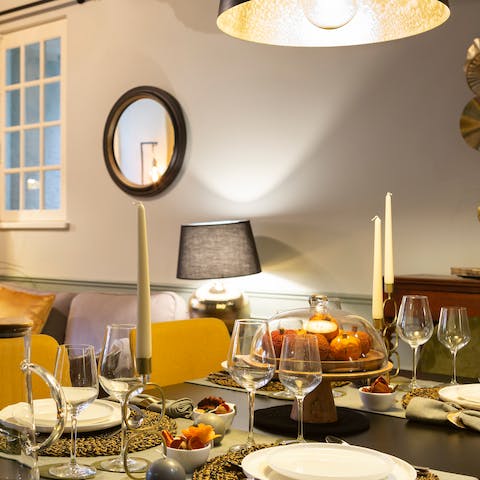 Gather around the lovely dining table for cosy dinners and drinks at home, with the low-hanging light setting the ambience