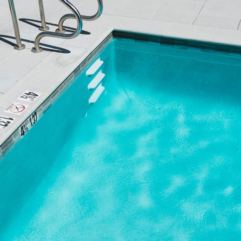 Enjoy a cooling dip in the shared swimming pool