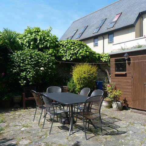 Enjoy alfresco barbecue meals on the garden's patio