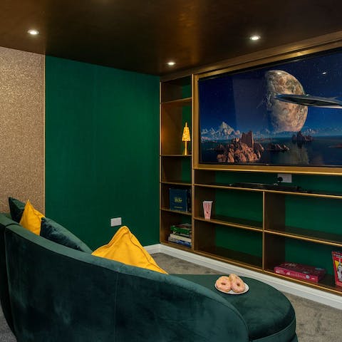 Experience movie nights together in this cosy cinema room