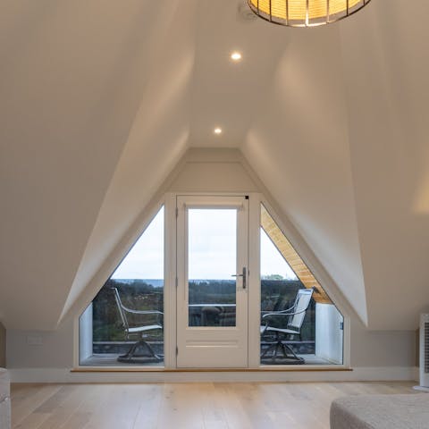 Drink in the views from the stunning gable end balcony