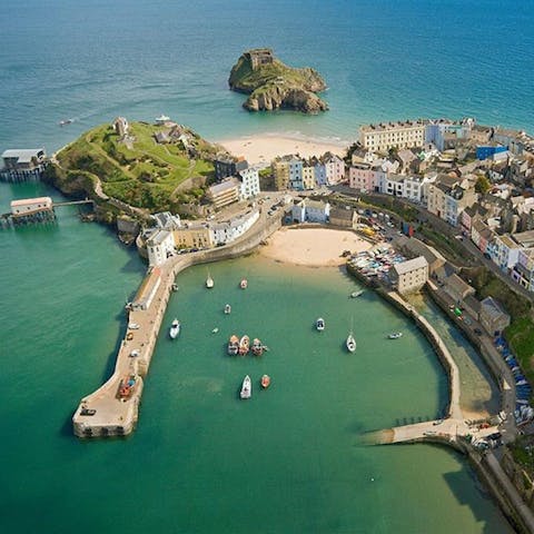 Visit the sun-soaked harbour of nearby Tenby