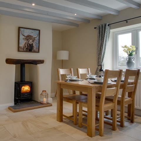Light the wood burner and gather around the table for a glass of wine