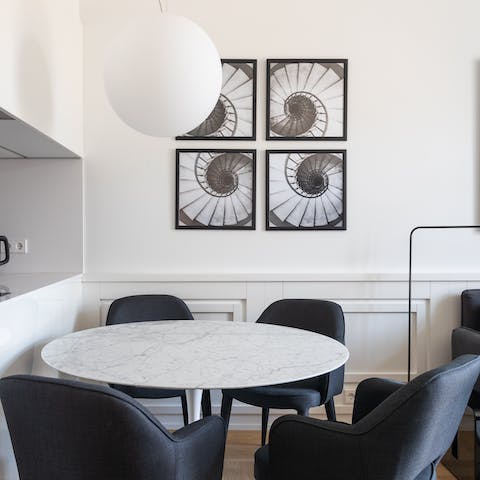 Gather around the monochrome dining table in the mornings and evenings