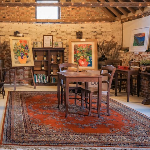 Admire the gallery of art and locally produced wine at the on-site wine cellar 