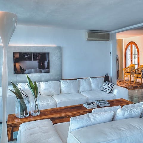 Gather for cosy evenings of wine and movies in the plush living room