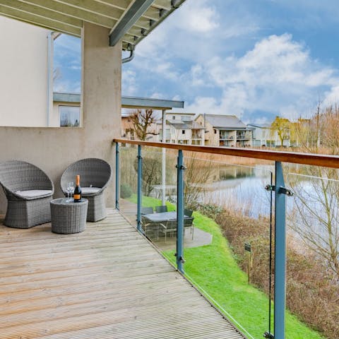 Enjoy views across the lake while relaxing on the balcony