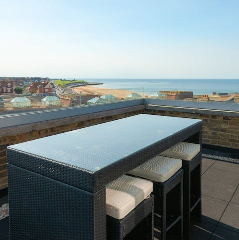 Enjoy a drink with a view on the penthouse terrace
