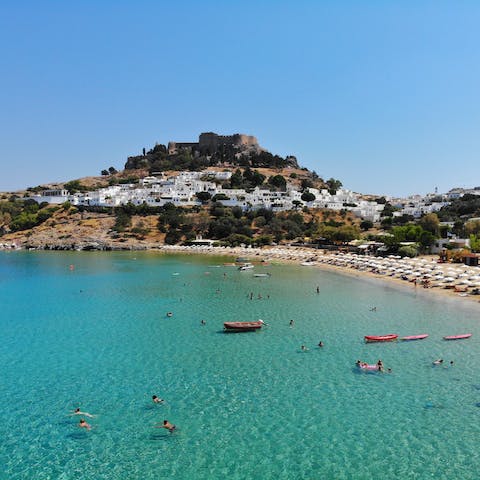 Stay 1.5 kilometres from Lindos' shores, overlooked by the ancient acropolis