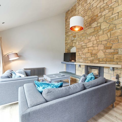 Cosy up on the sofas by the fire after a blustery winter walk along the coast