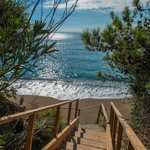 Walk down your private stairs to Ferma Beach, 30 metres away