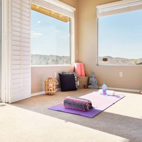 De-stress with some yoga and  admire the mountain views