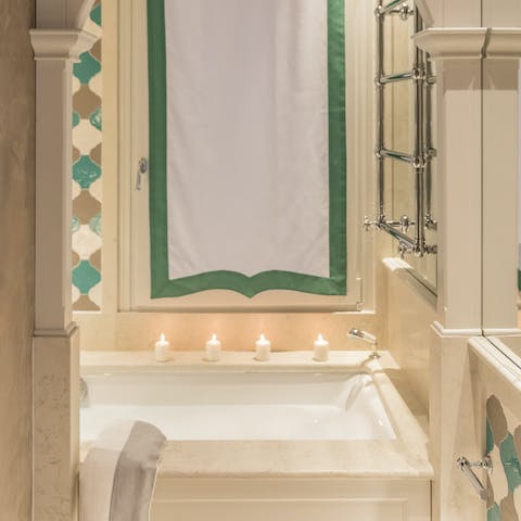 Light some candles and sink into the hot suds of the bathtub