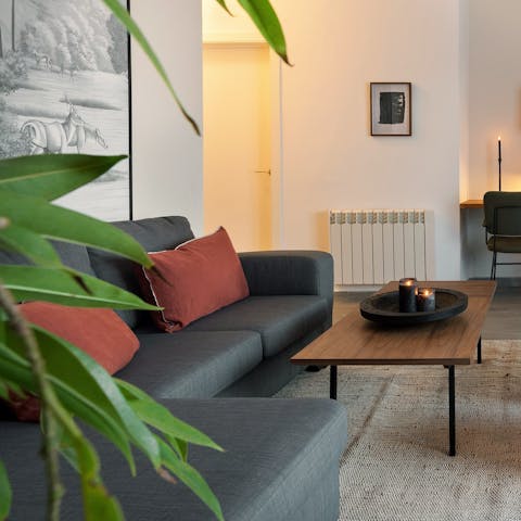 Lounge on the L-shaped sofa as you listen to tunes on the record player