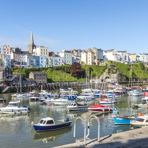 Watch the sunset from Tenby Harbour, a twelve-minute stroll from your doorstep