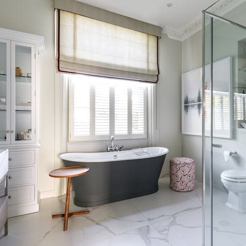 Indulge yourself with a leisurely soak in the freestanding bathtub