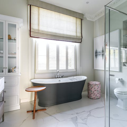 Indulge yourself with a leisurely soak in the freestanding bathtub