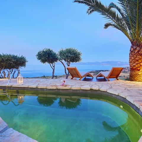 Gaze out at the ocean from your poolside perch on the hillside