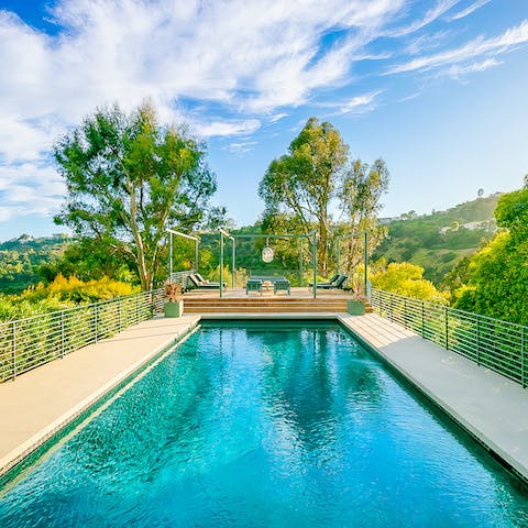 Take a dip in the pool under the scorching sun