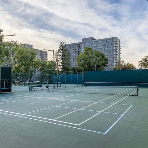 Get competitive with friends on the communal tennis courts