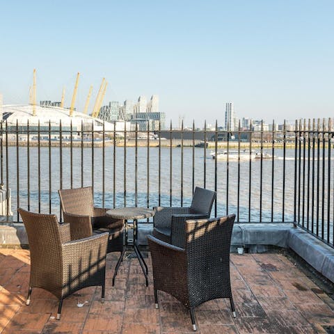 Gather at the communal roof terrace to share drinks and river views