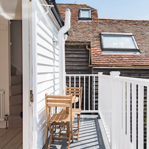 Enjoy your morning coffee on the balcony, looking over the luscious gardens below