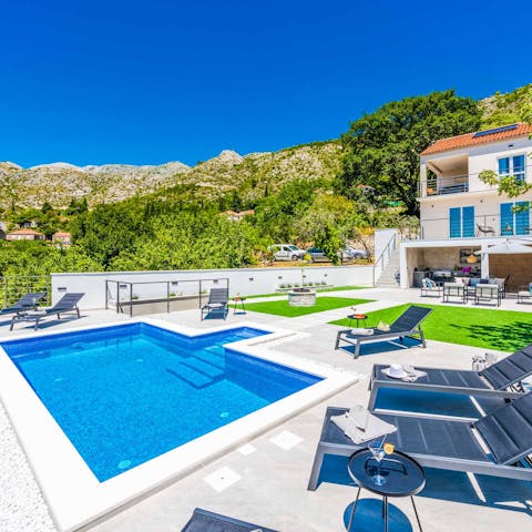 Soak up the sun on the comfy loungers and take refreshing dips in the pool 