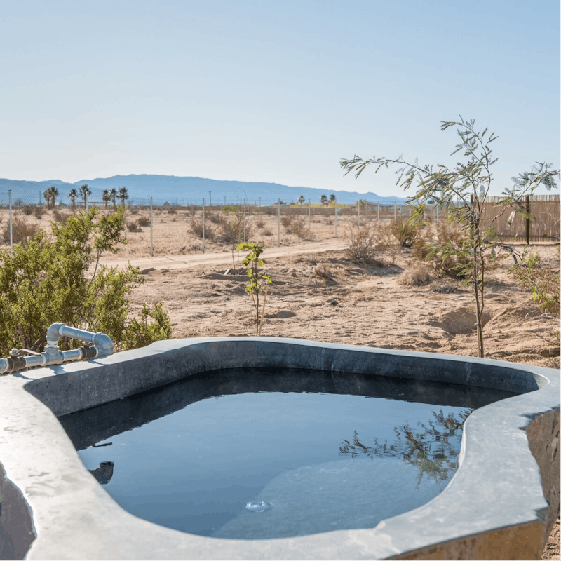 Marvel at the natural landscape while soaking in a hot springs tub