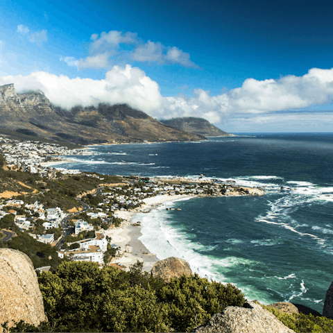 Relax on Camps Bay Beach throughout the day