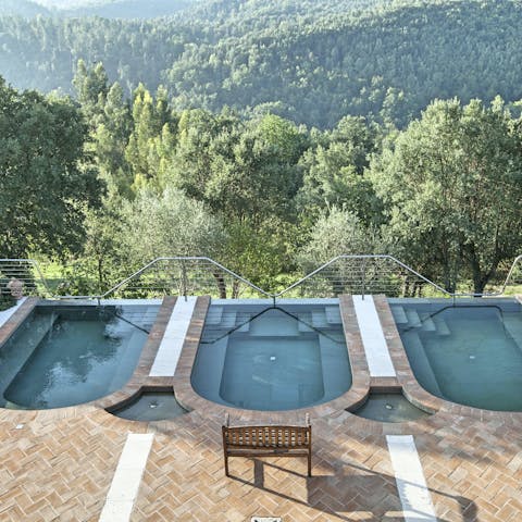 Take a dip in one of the three Roman baths, admiring the Tuscan views
