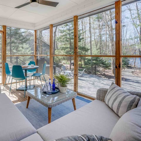 Curl up with a book and a glass of wine in the enclosed porch 