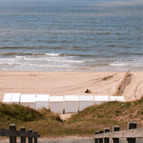 Build sandcastles at Strand De Haan – it's a short bike ride away