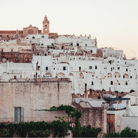 Visit the whitewashed city of Ostuni, a short drive away