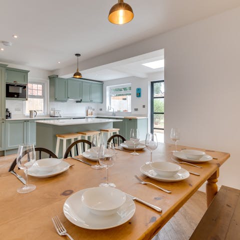 Enjoy a feast at the large honey-hued table