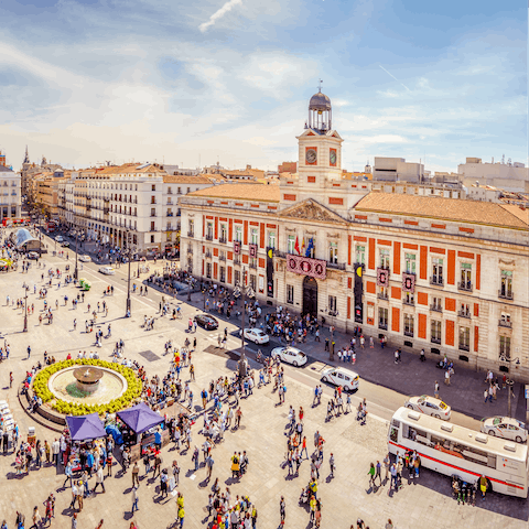 Visit Puerta del Sol, Madrid's most renowned square, only a fifteen-minute stroll away